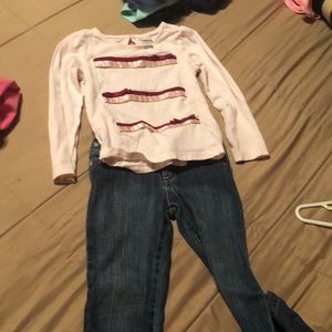 Pale pink long sleeve shirt and jeans